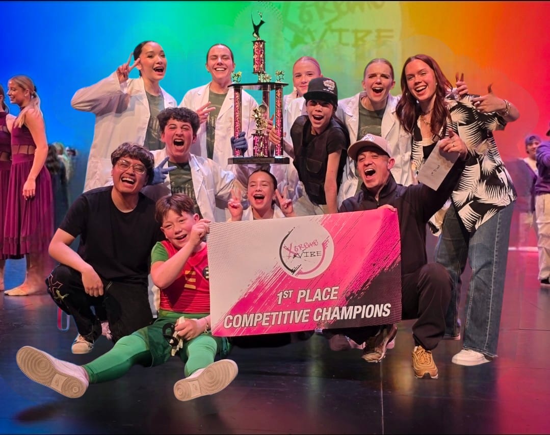 Pound It dancers celebrating with a first-place trophy